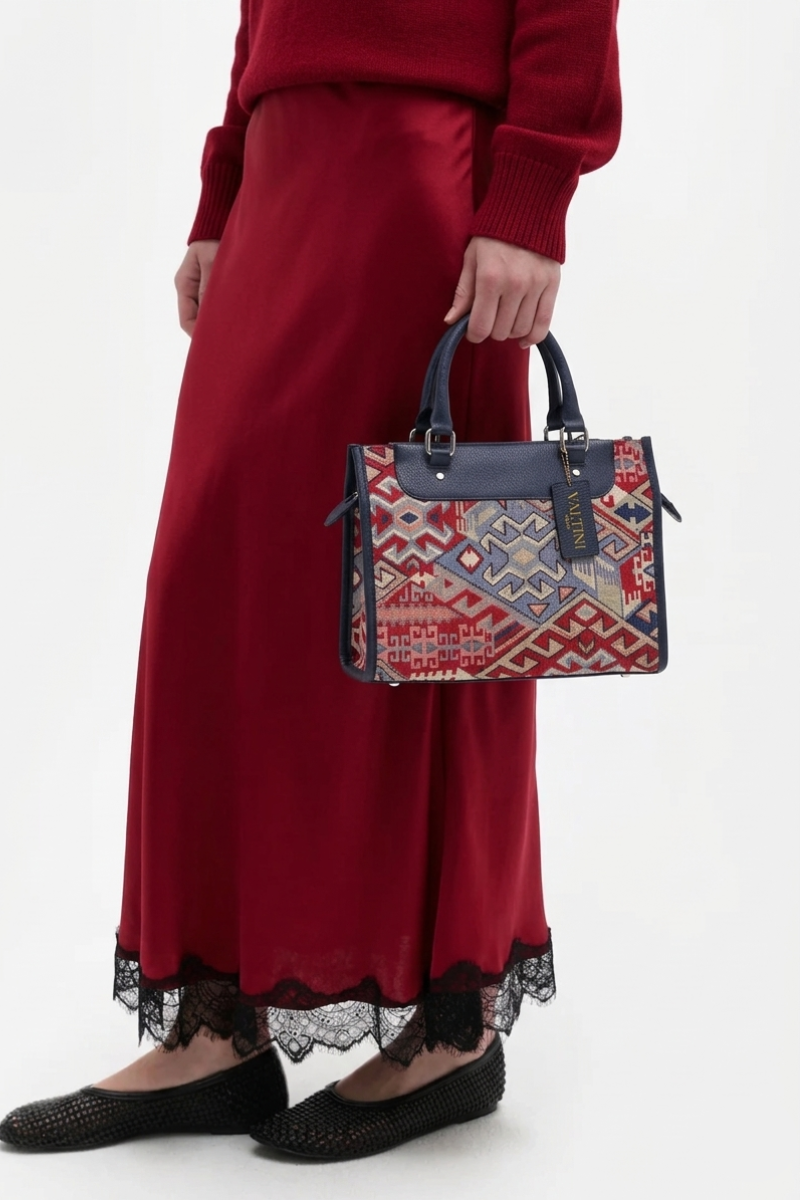 Woman carrying luxury jacquard woven handbag